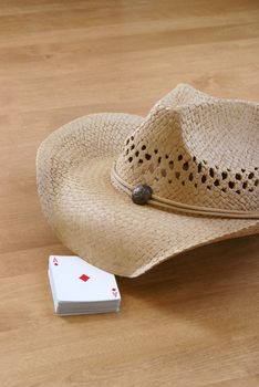 A deck of cards and a hat are holding the table for the comming players.