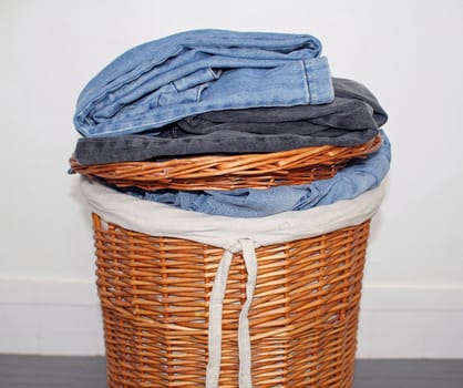 wicker basket, laundry placed on it