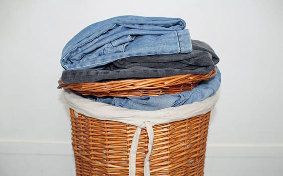 wicker basket, laundry placed on it