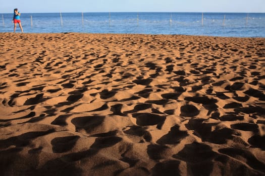 sand shadows cast during sunset in a shallow depth of field