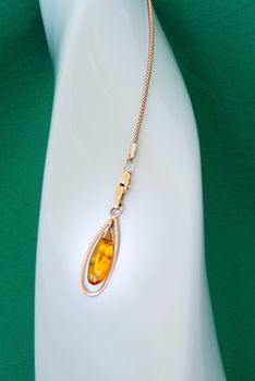 Amber pendant with golden chain