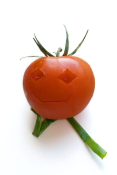 Funny tomato with green onions