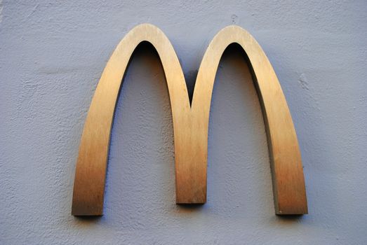 A McDonalds logo on a wall.