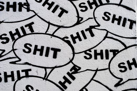 Stencils displaying the word 'Shit'.