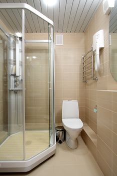 Beautiful modern bathroom with a shower and a toilet bowl