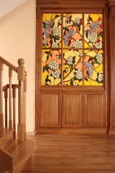 Ladder in a cottage with a wooden handrail