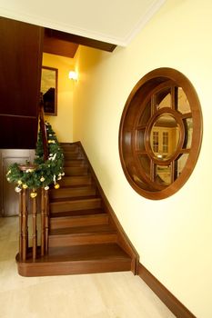 Wooden ladder and round window