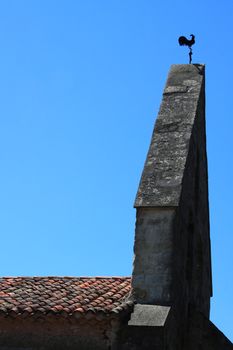 Traditional French weathervane on the parish church at Lagardere SW France