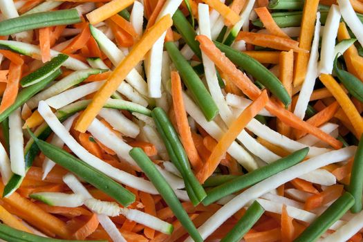 Background of julienne vegetables:  green beans, baby marrows and carrots