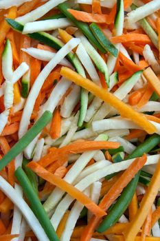 Background of julienne vegetables:  green beans, baby marrows and carrots