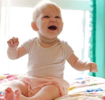 Portret of little laughing girl