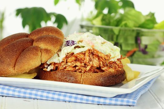 Slaw burger with whole wheat buns, fries and salad.