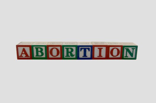 Wood Alphabet blocks spelling abortion