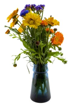 Bouquet of Yellow Orange Blue Flowers in a clear blue glass vase