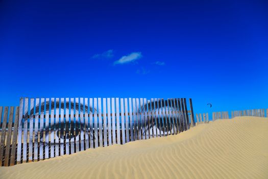 Superposed eyes on the boards of a dune of Cortadura's beach ( Cádiz )