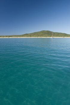 A lone yacht moored off great keppel island, queensland, australia