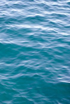 smooth ripples on the surface of a calm ocean