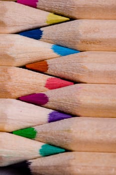 A composition of pencils of wood in a variety of colors