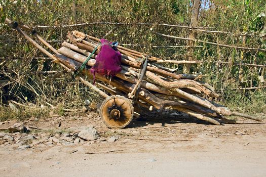 wooden truck on a road  with logs in  myanmar, shan state, Inle Lake
