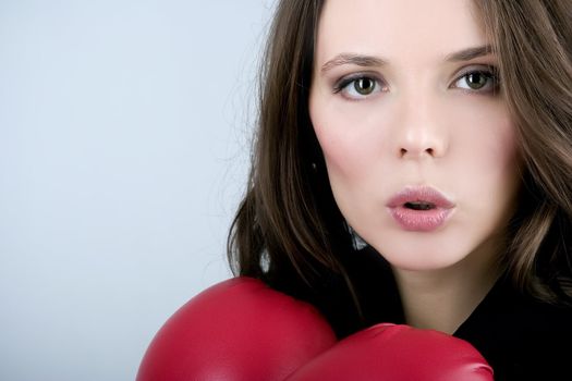 Pretty bussiness boxing woman with red gloves