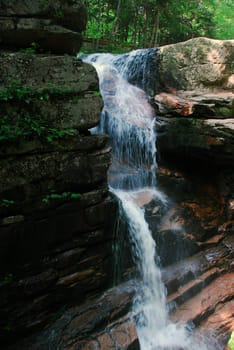 Picture of a natural small water fall in summer