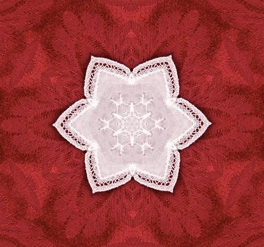 hexagonal lace star on red tapestry background