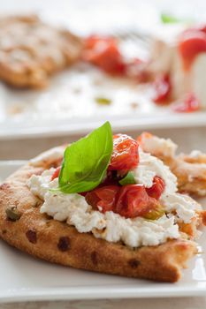 Bread with ricotta, tomatoes and basil