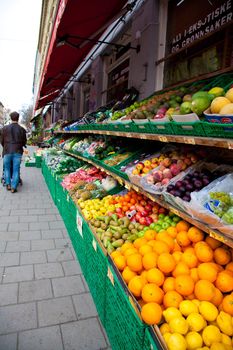 A greengrocer's shop in Oslo, Norway. with person in background.