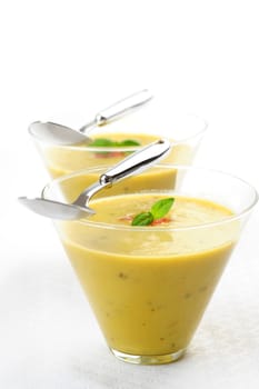 Two glasses of cream of asparagus soup.