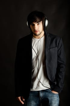 Young Man listening to music with headphones