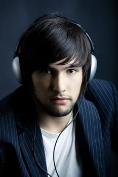 Young Man listening to music with headphones