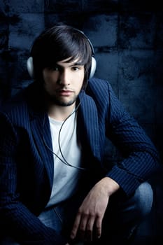 Young Man listening to music with headphones