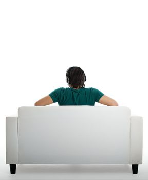 Back view from a young man seated on the couch 