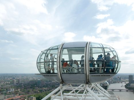 Tourist inside the egg-shaped and air-conditioned passenger capsule of London Eye