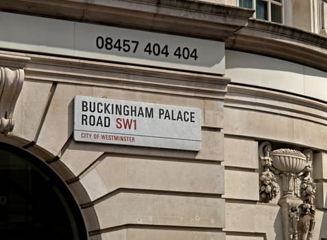 buckingham palace road sign at westminster city, england