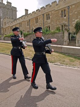 Marching Foot Guards at the changing of guards at Windsor Castle, the largest inhabited castle in the world. The Foot Guards are the infantry regiments of the British Army.