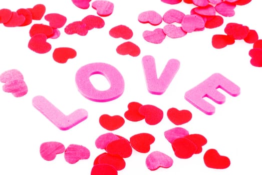 The word love surrounded by little hearts, isolated on white.