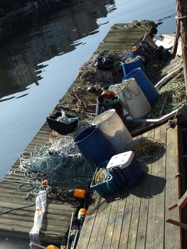 A working lobster boat dock along the dock in Portland, Maine during the summer