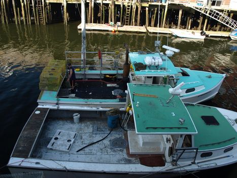 Working lobster boats along the dock in Portland, Maine during the summer