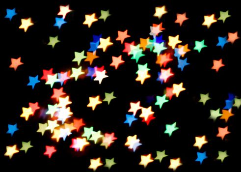 Colorful bokeh star-shaped christmas lights