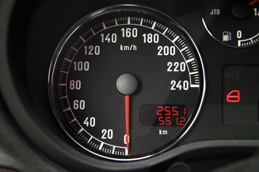 Closeup of a black speedometer of a car