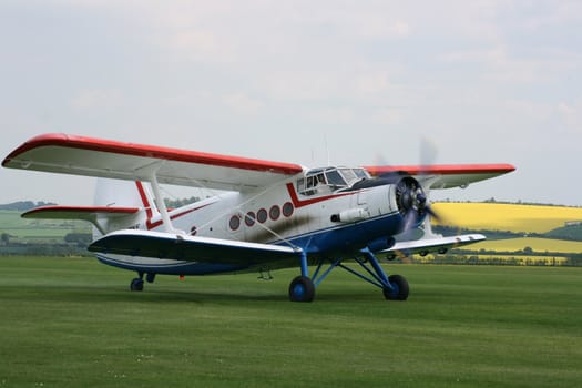 The Antonov An-2 a light, single-engine biplane which first flew in 1947. Used for light transport, parachute drops and agricultural work. Image taken at Old Sarum Airfield, Salisbury,Wiltshire UK. 