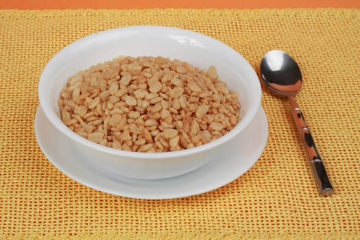 healthy cereal in a white bowl, yellow tablecloth