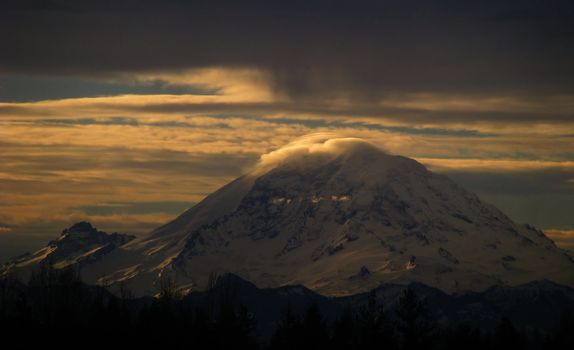 Sunrise on Mt. Rainier over the skies of Washington State.
