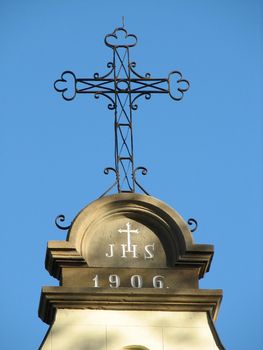 iron cross on top of a church