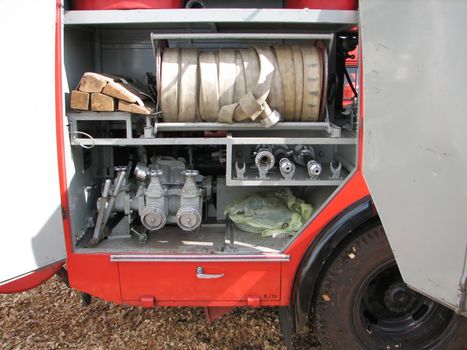 equipment inside a fire brigade car, seen on a street, open to the public for show