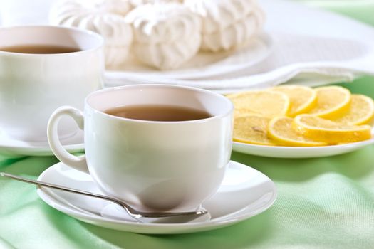 white cup of tea with lemon, hot drink