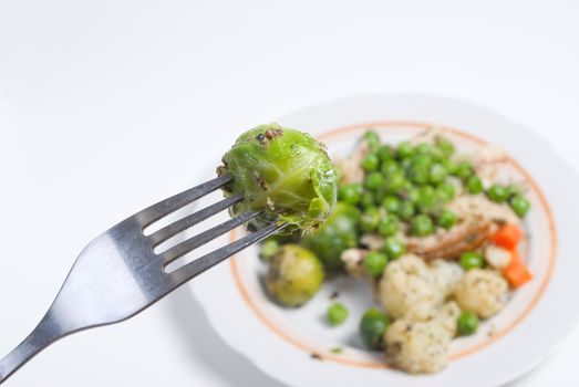 Brussels sprouts on fork.Vegetable dish