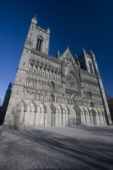 The famous Nidaros Cathedral in Trondheim, Norway. One of the oldest and northernmost cathedrals in northern Europe. Now stands as a popular tourist attraction, as well as a place for worship and pilgrimage for Norwegians and the like. 