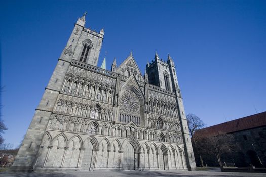 The famous Nidaros Cathedral in Trondheim, Norway. One of the oldest and northernmost cathedrals in northern Europe. Now stands as a popular tourist attraction, as well as a place for worship and pilgrimage for Norwegians and the like. 